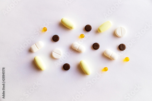 assorted pills and capsules in medicine. drugs of various kinds and different colors. Medicine on white background.Copy space photo