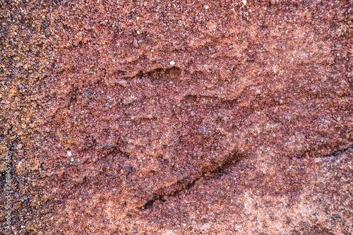 texture facing red brick with dark splashes closeup