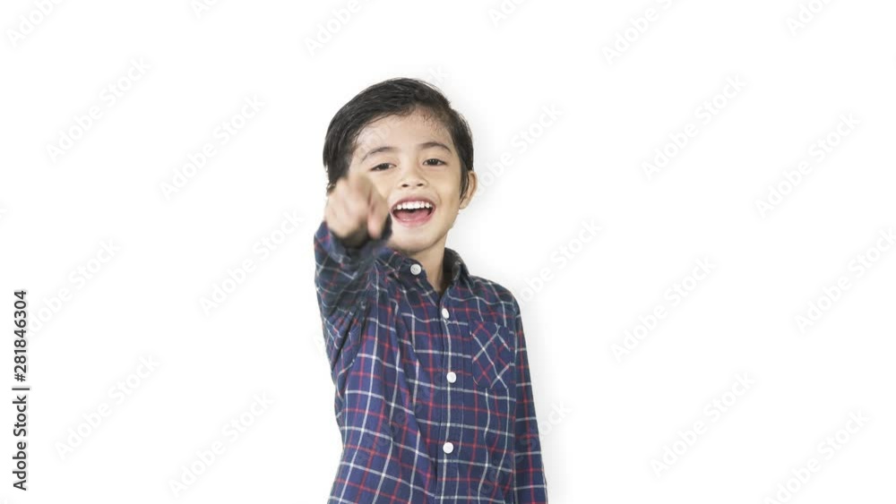 Little boy laughing in the studio while pointing at the camera looks mocking someone, isolated on white background. Shot in 4k resolution Little boy laughing in the studio while pointing at the camera looks mocking someone, isolated on white background. Shot in 4k resolution