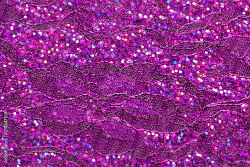 Abstract textured background of pink sequins and lace. © Helen Davies