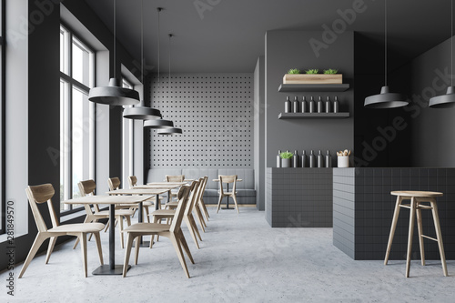 Dark gray bar interior with sofa