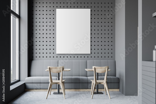 Dark gray restaurant with sofa and poster