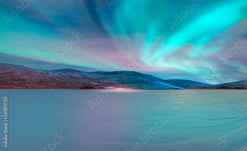 Northern lights  Aurora borealis  in the sky with super full moon - Tromso  Norway  Elements of this image furnished by NASA