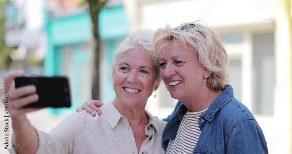 Mature lesbian couple taking selfie on vacation Stock-Video | Adobe Stock