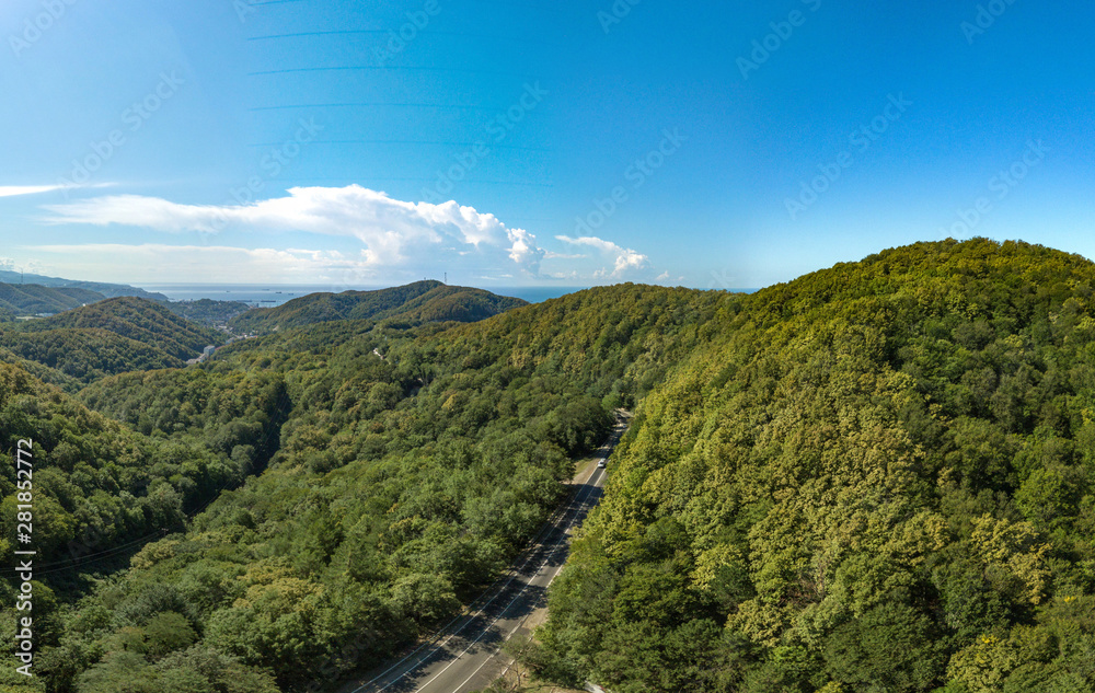 on the mountain pass of the seaside road on a sunny and cloudless summer day. Drone aerial view