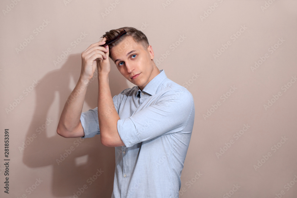 European guy combing his hair European guy combing his hair