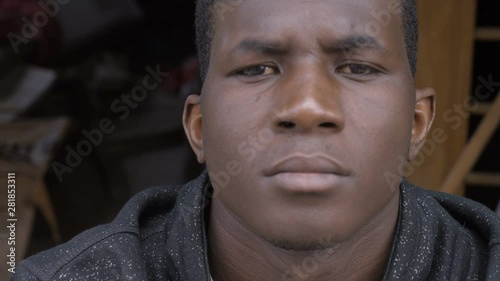 angry confident young african black man staring at camera - outdoor photo