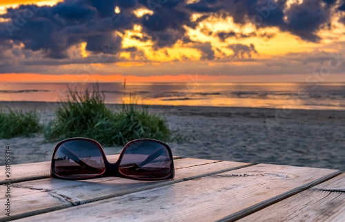 Colorful sunset on sandy beach of the Jurmala - famous international tourist ...