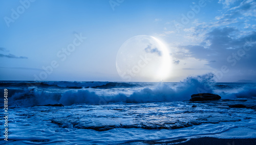 Moon over the sea with lot of stars and nebula at night "Elements of this image furnished by NASA