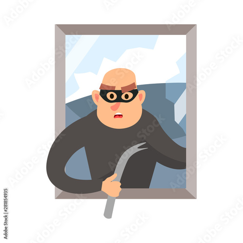 Modern burglar with black mask broken the house window