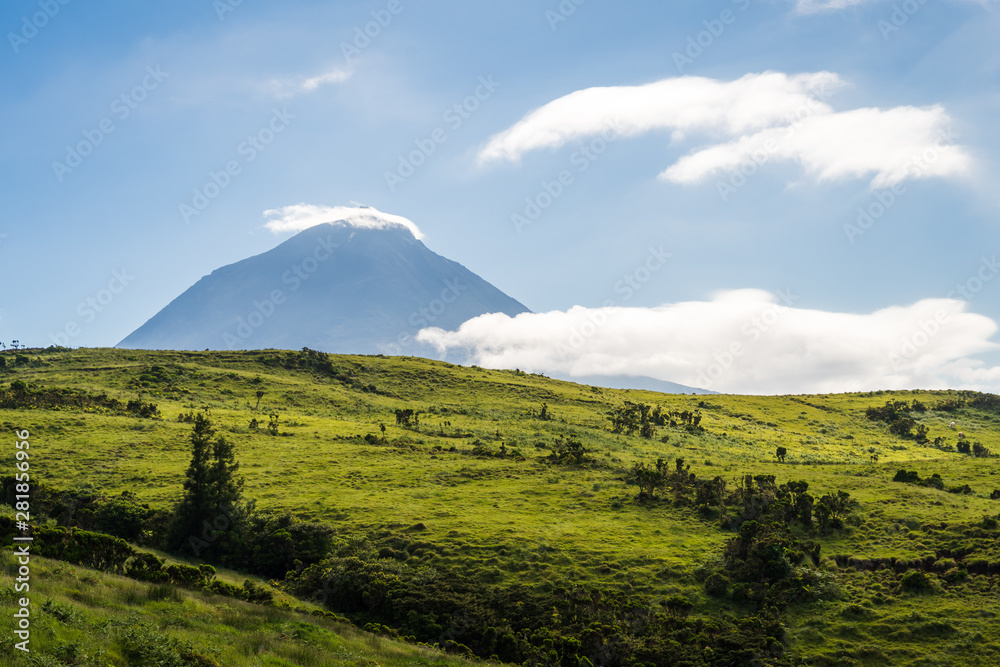Pico Vulcano with green meadows against blue sky, Pico Island, Azores Islands, Portugal
