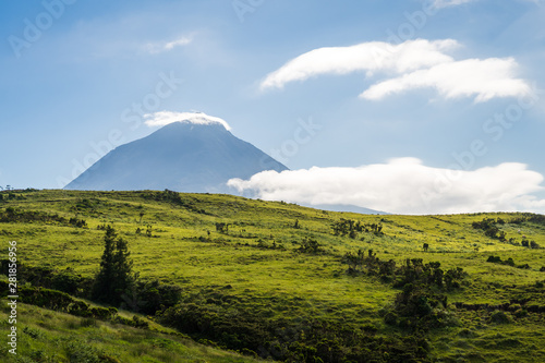 Pico Vulcano with green meadows against blue sky, Pico Island, Azores Islands, Portugal © Tobias
