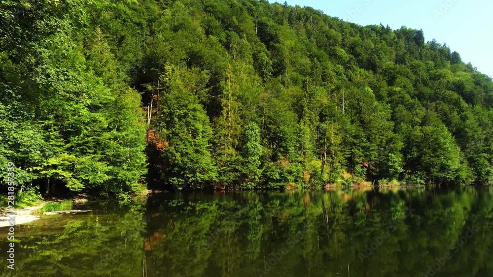 Beautiful views of forest lake with reflection of green trees and grass. Beautiful views of forest lake with reflection of green trees and grass.