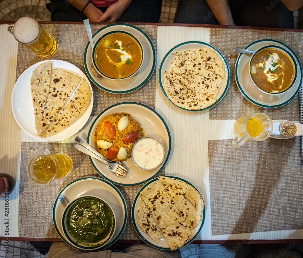 Typical nepalese meal and beer in Pokhara restaurant, Himalayas, Nepal. Assorted indian nepalese
