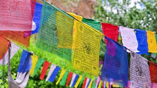 Tibetan buddhist prayer flags blowing in the wind