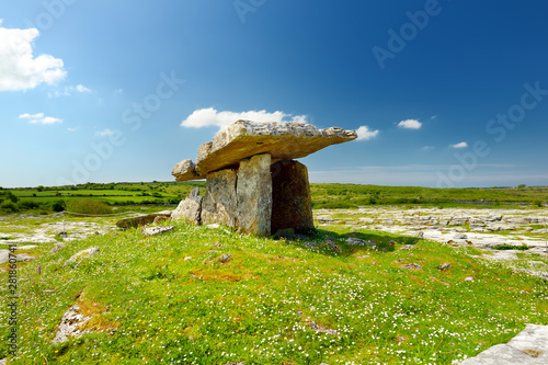 Photography Poulnabrone dolmen, a neolithic portal tomb, tourist attraction located in the B