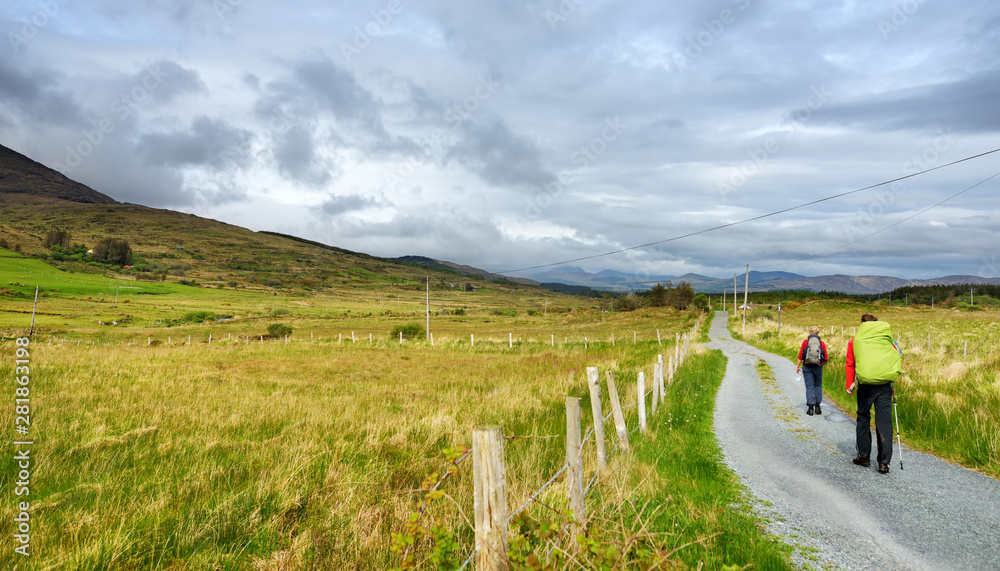 hikers-ascend-a-trail-on-a-cloudy-day-in-the-killarney-national-park