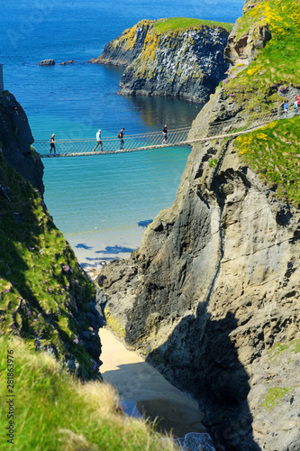 Carrick-a-Rede Rope Bridge, famous rope bridge near Ballintoy in County Antrim, linking the mainland to the tiny island of Carrickarede. photo