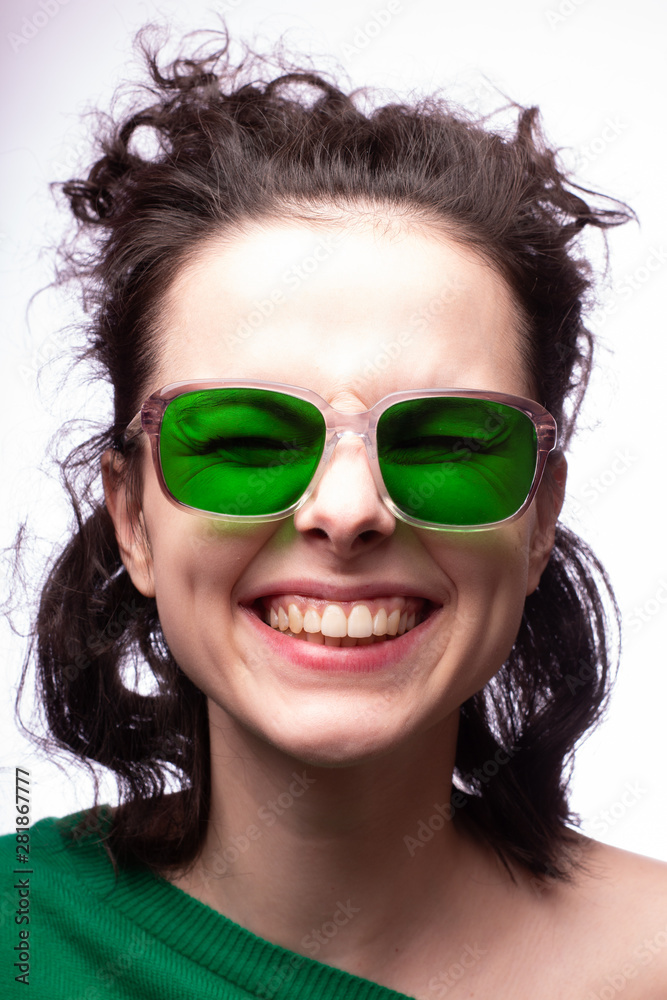 beautiful girl in green glasses and green sweater