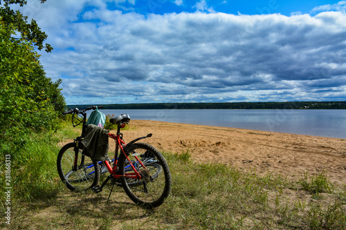 Two bicycles on the shore of the lake