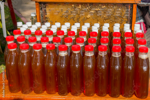 BOTTLES WITH NATURAL PURE HONEY photo