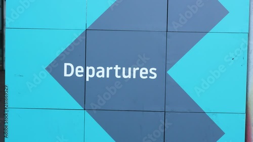 Departures sign outside of the Luton Airport photo