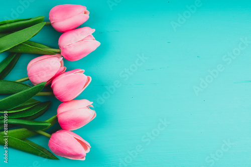 Fototapeta Naklejka Na Ścianę i Meble -  pink tulips onclaret red background