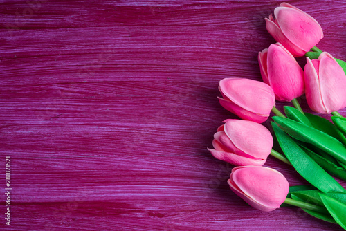 Fototapeta Naklejka Na Ścianę i Meble -  pink tulips onclaret red background