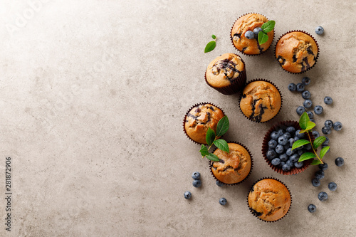 Blueberry muffins with fresh berries, top view