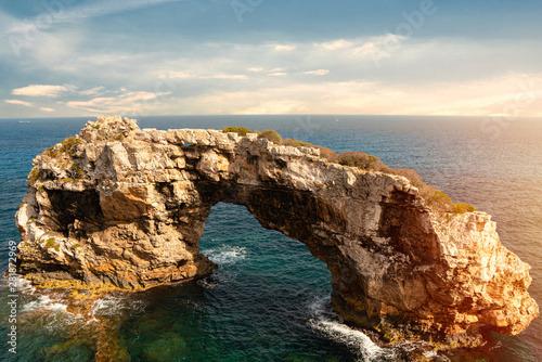 Rocky Arch in the sea, amazing natural wonder. Popular tourist destinations. Mirador Es Pontas, Samtanyi, Palma de Mallorca, Balearic Islands. photo