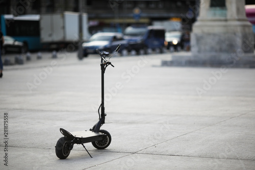 Shallow depth of field image with a parked electrical scooter in downtown Bucharest
