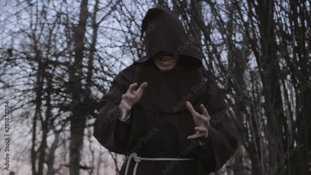 Medieval Necromancer Mumbling Сurses In A Forest Medieval Necromancer Mumbling Сurses In A Forest