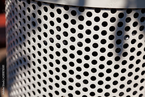 close up of gray garbage basket in Roback, exciting circle pattern