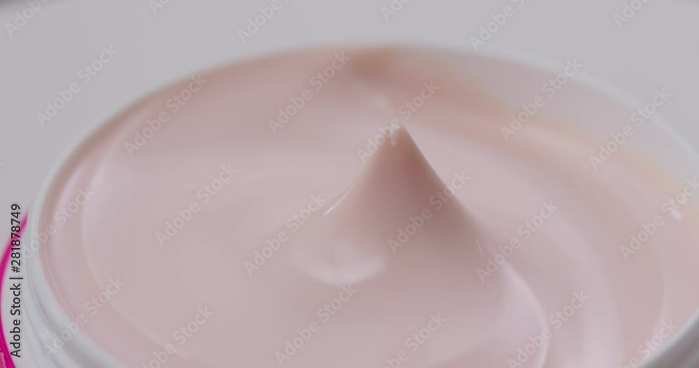 Closeup shot of cosmetics cream in rotation Closeup shot of cosmetics cream in rotation