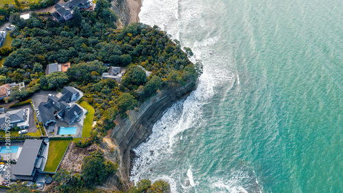 Aerial View from the Beach, Green Trees and Cliff of Orewa in New Zealand - Auckland Area photo
