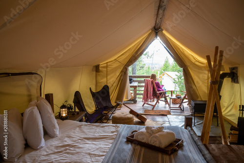 woman glamping in forest photo