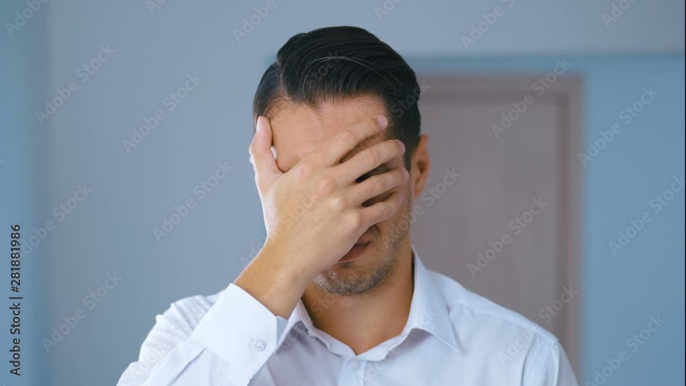 Portrait of shocked man doing facepalm. Unpleasantly surprised businessman. Concept of disappointment, shame and embarrassment. Portrait of shocked man doing facepalm. Unpleasantly surprised businessman. Concept of disappointment, shame and embarrassment.