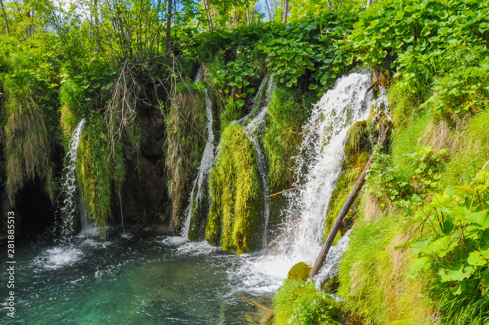 Naklejka premium Beautiful Plitvice Lakes National Park in Croatia during the summer. Waterfalls and lakes complete this lush wonderland.