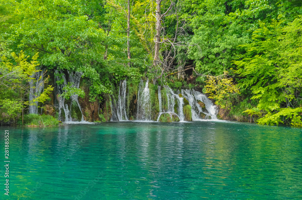 Beautiful Plitvice Lakes National Park in Croatia during the summer. Waterfalls and lakes complete this lush wonderland.