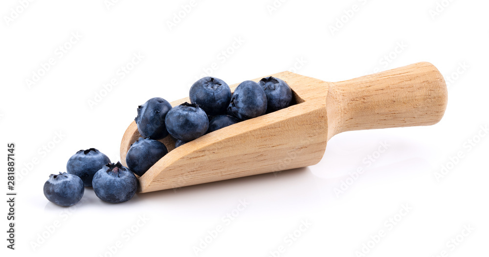 Blueberries in wood scoop  isolated on white background