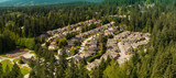 Aerial panoramic view of residential neighborhood in North Vancouver during a sunny day. Located in British Columbia, Canada.