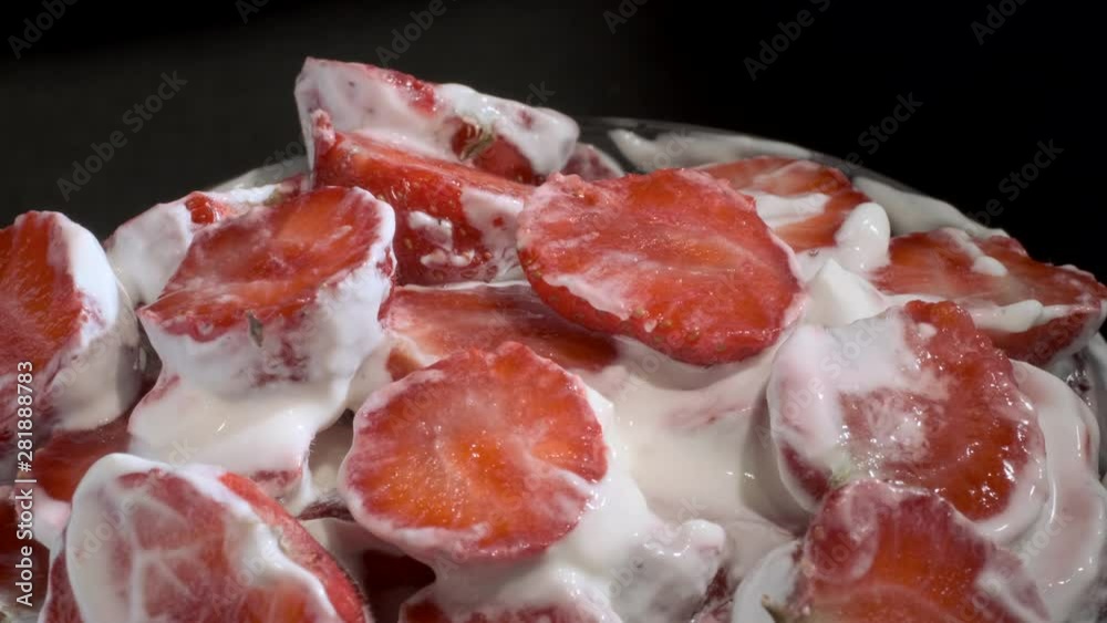 Rotation of piece luice strawberries covered with thick layer of cream on black background. Camera rotation 360 degrees, close-up. 4K - 50fps Rotation of piece luice strawberries covered with thick layer of cream on black background. Camera rotation 360 degrees, close-up. 4K - 50fps