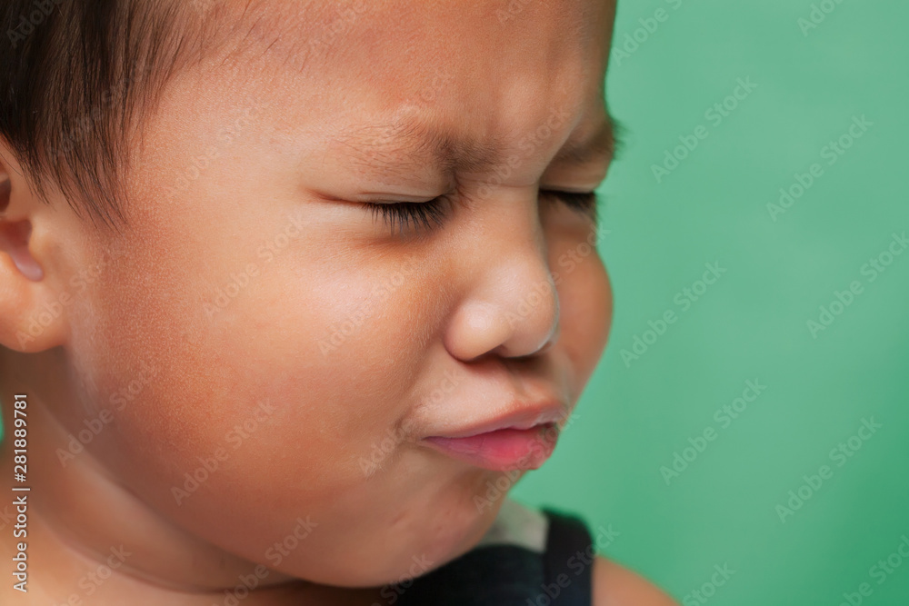 Little kid with facial expression that shows sadness or crying. Little kid with facial expression that shows sadness or crying.