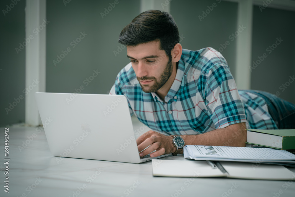 success concept. Young modern businessman relaxing with computer while sitting in the office. The successful business analysis, creative design to analyze the management of the investment. success concept. Young modern businessman relaxing with computer while sitting in the office. The successful business analysis, creative design to analyze the management of the investment.