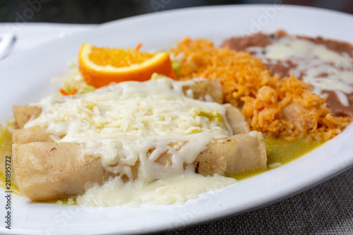 A closeup view of an enchilada plate