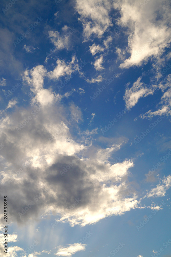 Obraz premium Large white cumulus clouds on a blue sky for background or ecology or nature.