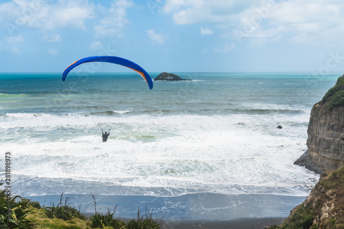 Paragliding. Flying Above The Ocean. Beautiful Muriwai Beach, Auckland Area, North Island of New Zealand