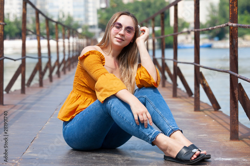 Beautiful Young Woman Outdoor. Enjoy Nature. Healthy Smiling Girl in the Spring Park.