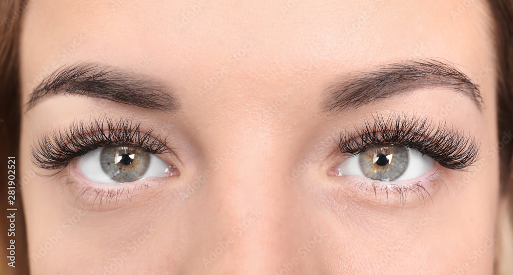 Fototapeta premium Beautiful young woman with eyelash extensions, closeup