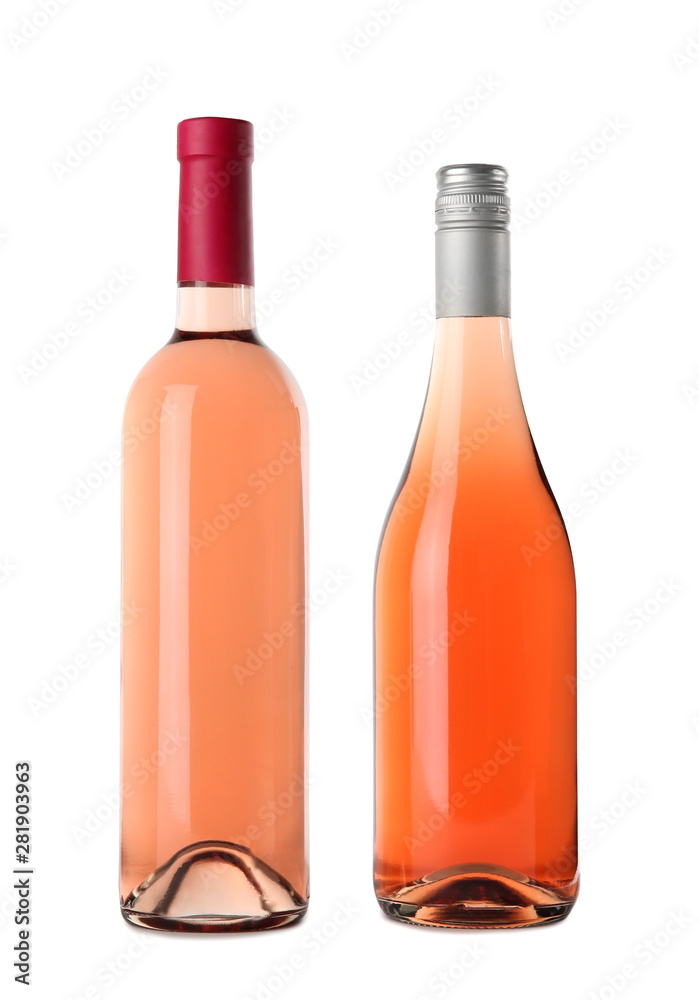 Bottles of delicious rose wine on white background. Mockup for design Bottles of delicious rose wine on white background. Mockup for design